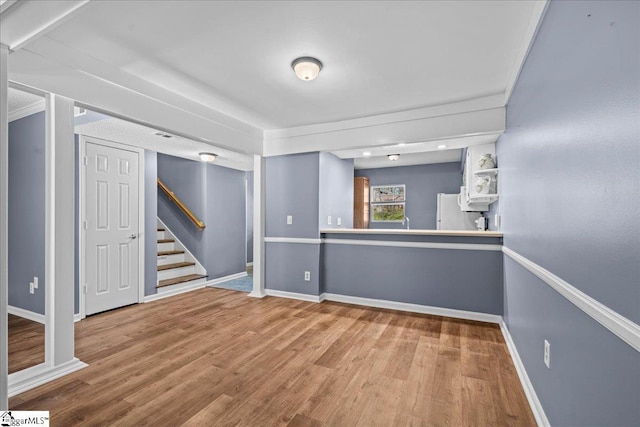 empty room with hardwood / wood-style flooring