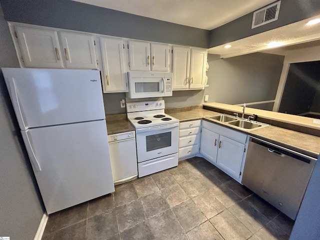 kitchen featuring kitchen peninsula, sink, white cabinets, and white appliances