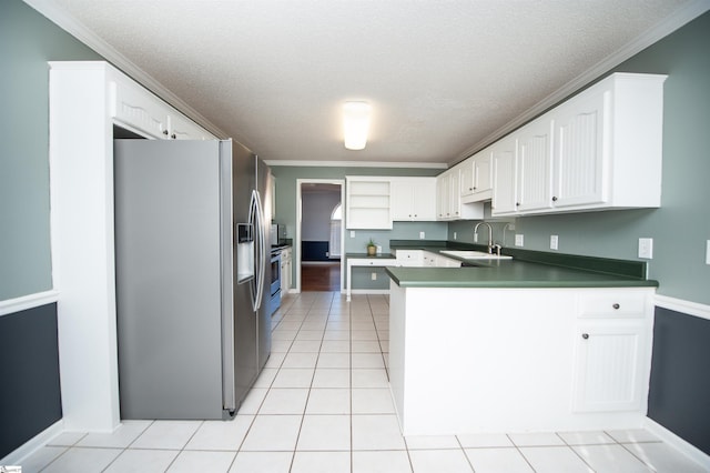 kitchen featuring white cabinetry, sink, stainless steel refrigerator with ice dispenser, a textured ceiling, and ornamental molding