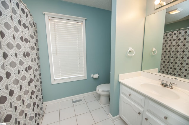 bathroom with tile patterned flooring, a textured ceiling, toilet, vanity, and a shower with shower curtain