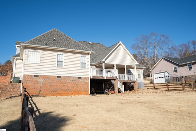 back of house featuring a deck