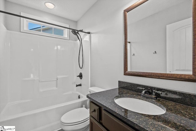 full bathroom with bathing tub / shower combination, vanity, and toilet