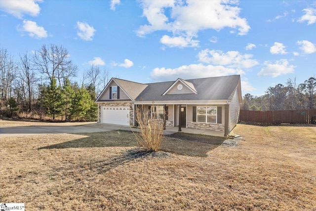 view of front facade with a porch, a garage, and a front yard