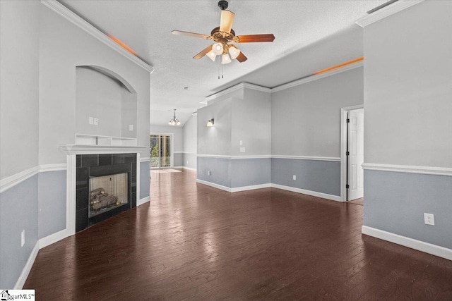 unfurnished living room with a textured ceiling, crown molding, a fireplace, and ceiling fan with notable chandelier