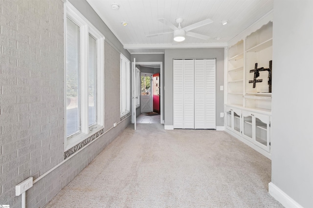 unfurnished bedroom with carpet floors, a closet, and ceiling fan