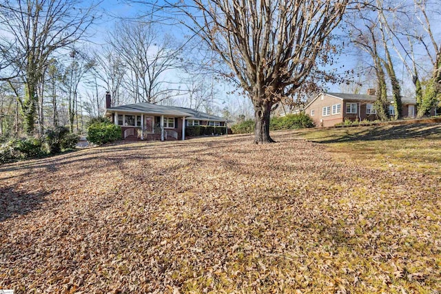 view of yard featuring covered porch