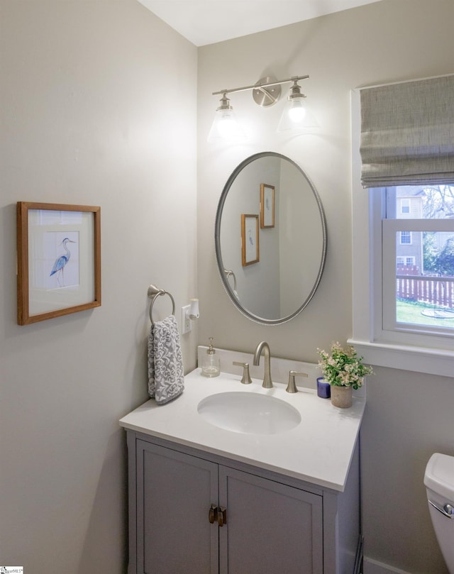 bathroom featuring vanity and toilet