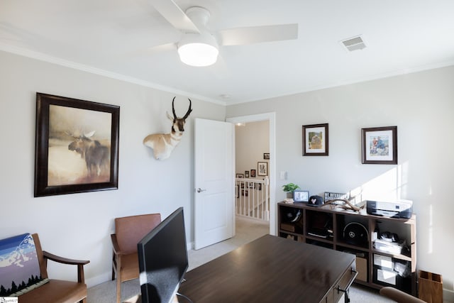 office space with light carpet, ceiling fan, and ornamental molding