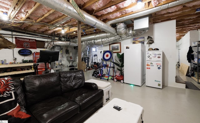 basement with white refrigerator