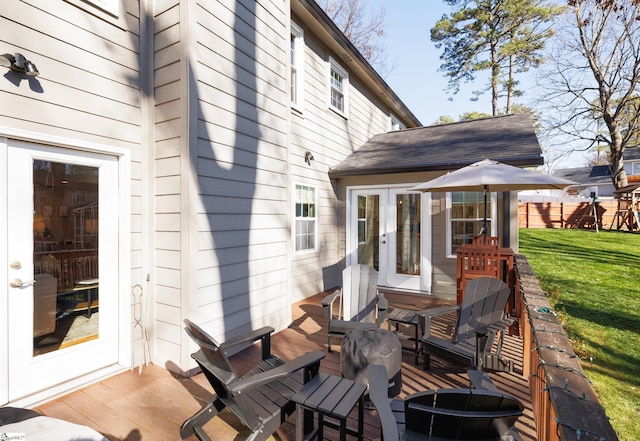 exterior space featuring a yard and french doors