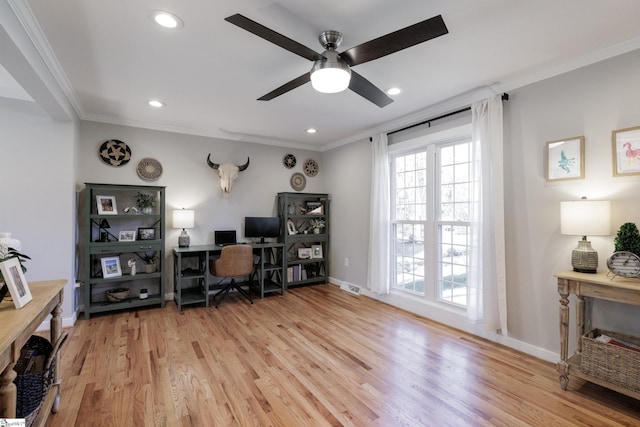 office featuring crown molding, light hardwood / wood-style flooring, and ceiling fan