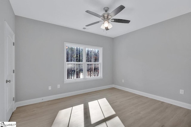 unfurnished room with light wood-type flooring and ceiling fan