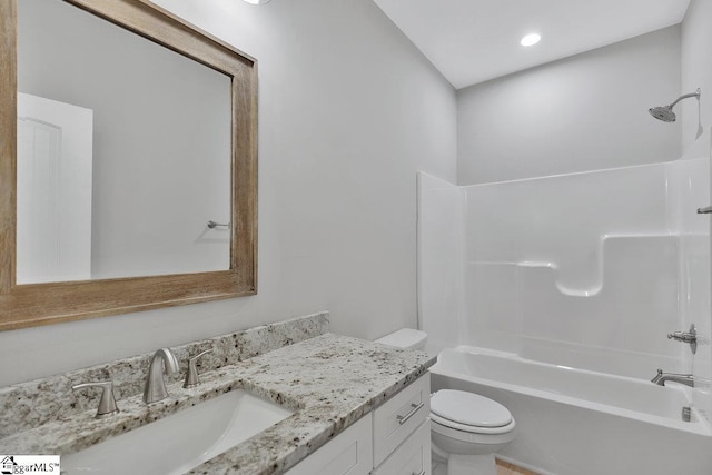 full bathroom featuring vanity, toilet, and tub / shower combination