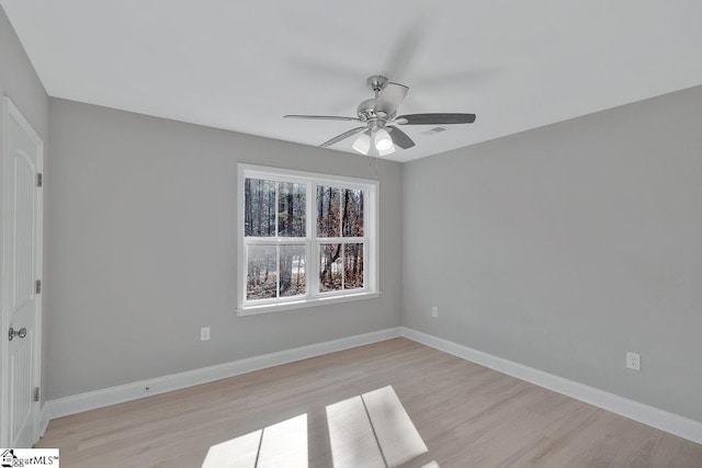 spare room with ceiling fan and light hardwood / wood-style floors