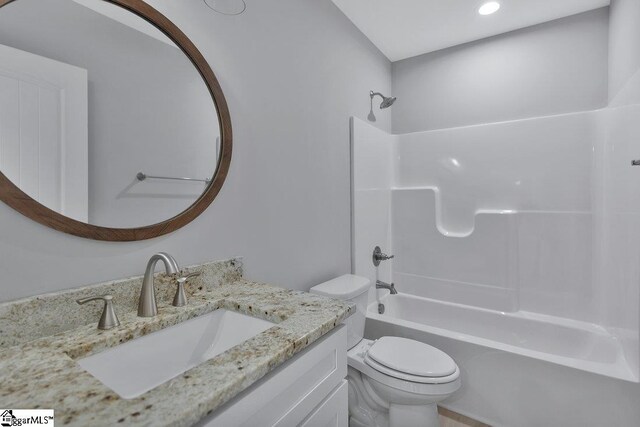 full bathroom featuring vanity, toilet, and tub / shower combination