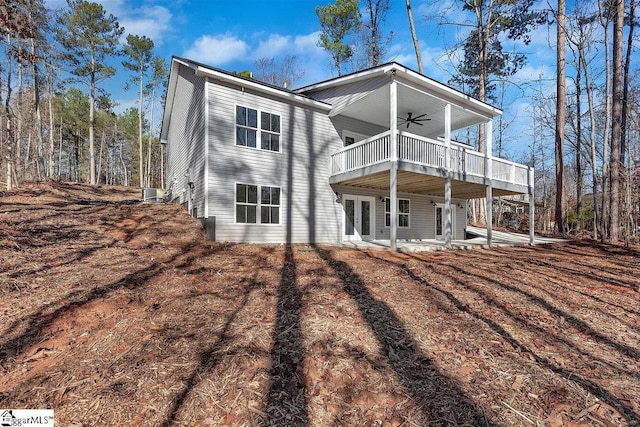 rear view of property featuring ceiling fan, a patio area, and french doors