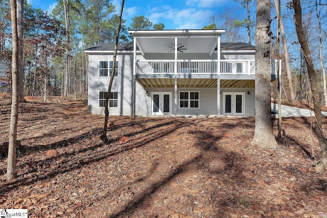 back of property featuring ceiling fan, a wooden deck, and french doors