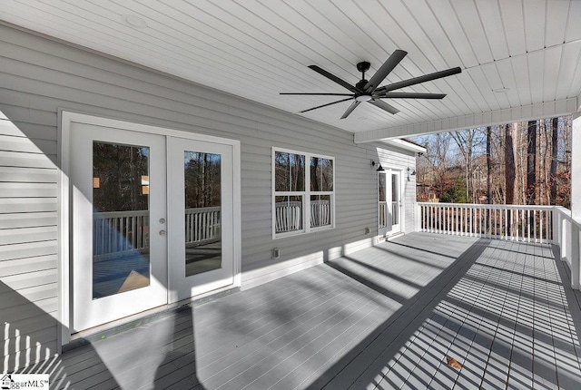 wooden terrace featuring ceiling fan and french doors