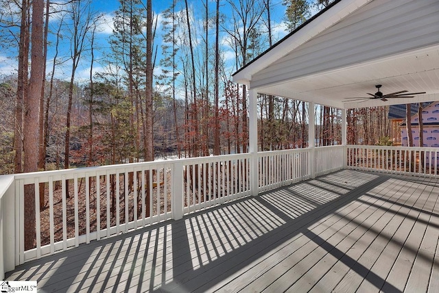 wooden deck featuring ceiling fan