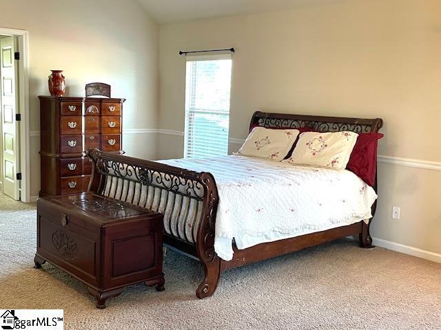 bedroom with light colored carpet