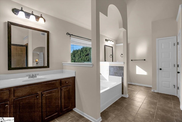 bathroom featuring tile patterned floors, vanity, and independent shower and bath