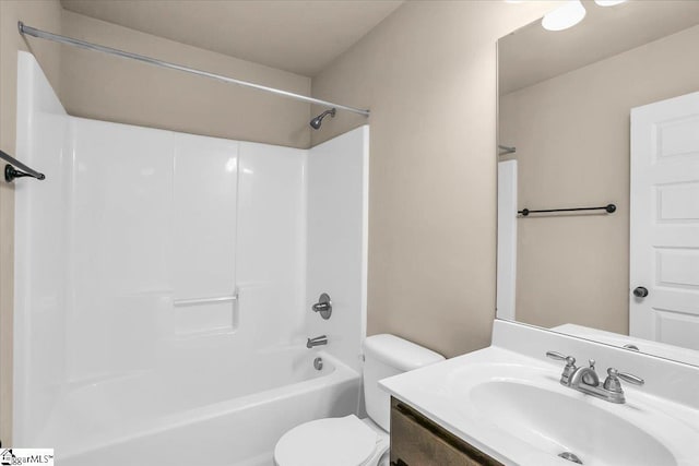 full bathroom featuring vanity, toilet, and washtub / shower combination