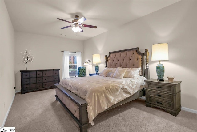 bedroom featuring ceiling fan and light carpet