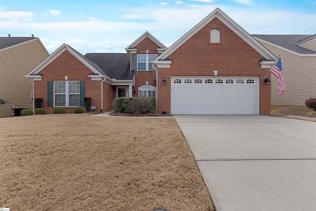 view of front facade featuring a garage and a front lawn