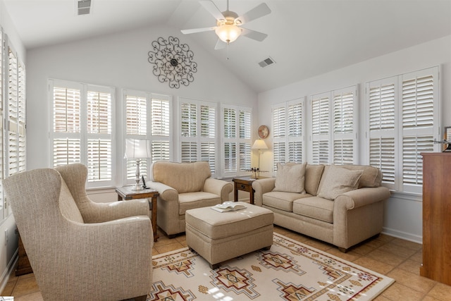 living room with light tile patterned floors, ceiling fan, and lofted ceiling