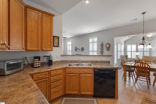 kitchen featuring sink, black dishwasher, pendant lighting, a chandelier, and lofted ceiling