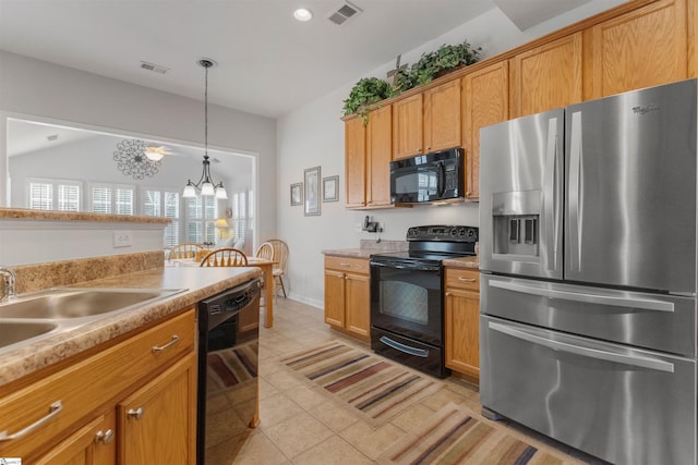 kitchen with pendant lighting, an inviting chandelier, black appliances, sink, and light tile patterned floors