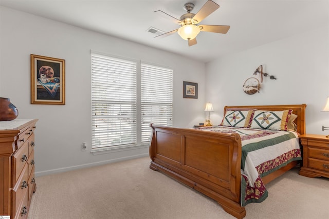 bedroom with light colored carpet and ceiling fan