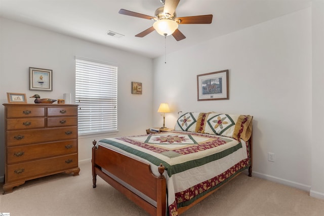 bedroom with light colored carpet and ceiling fan