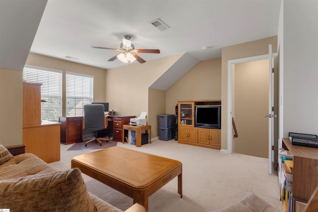 home office featuring light carpet and ceiling fan