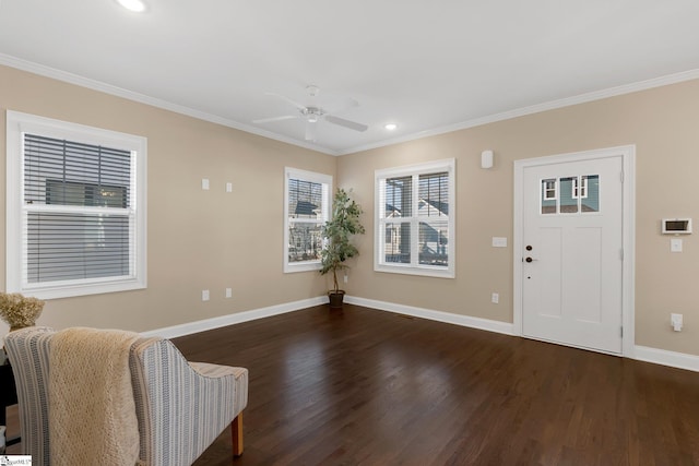 entryway featuring dark hardwood / wood-style floors, ceiling fan, and ornamental molding