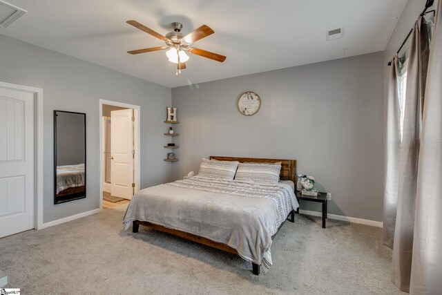 bedroom featuring ceiling fan and light carpet