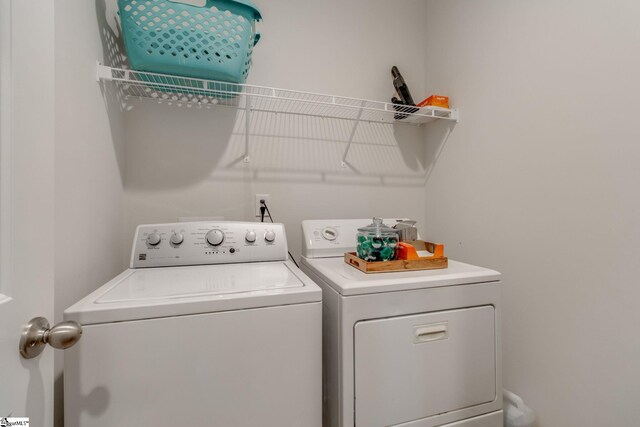 laundry room with washer and dryer