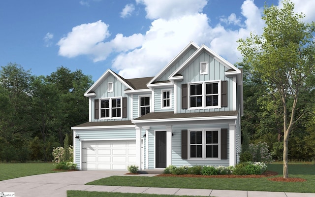 view of front of home with a front yard and a garage