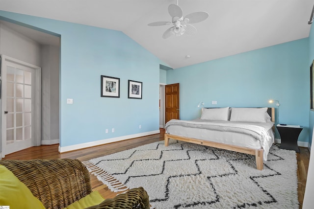 bedroom with ceiling fan, hardwood / wood-style floors, and lofted ceiling