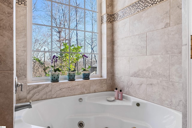 bathroom with plenty of natural light and a tub