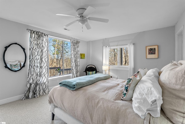 bedroom with ceiling fan and carpet