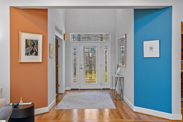 entryway with light hardwood / wood-style flooring