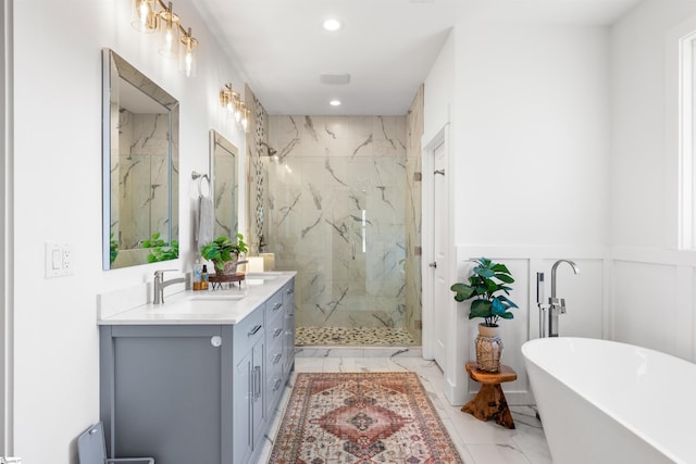 bathroom featuring separate shower and tub and vanity