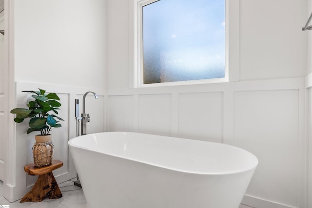 bathroom featuring a tub to relax in