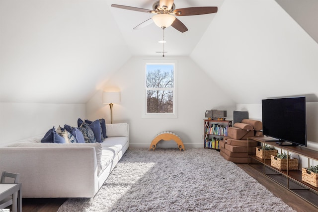 living room featuring dark wood-type flooring, ceiling fan, and lofted ceiling