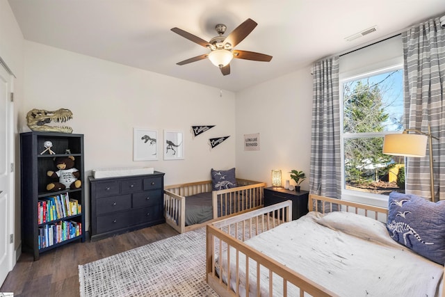 bedroom featuring dark hardwood / wood-style floors and ceiling fan