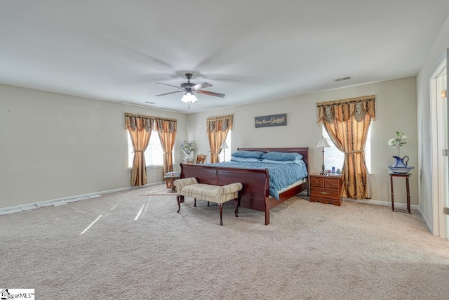 bedroom featuring light colored carpet and ceiling fan