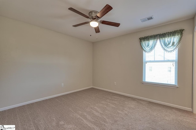 unfurnished room featuring light carpet and ceiling fan