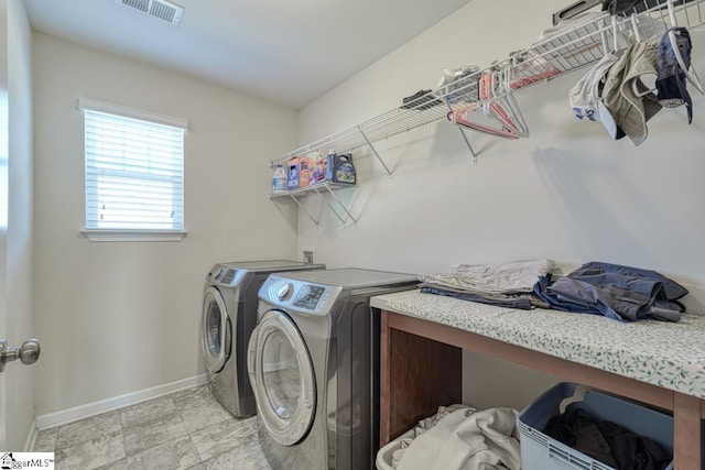 laundry room featuring independent washer and dryer