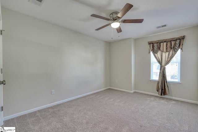 carpeted empty room with ceiling fan